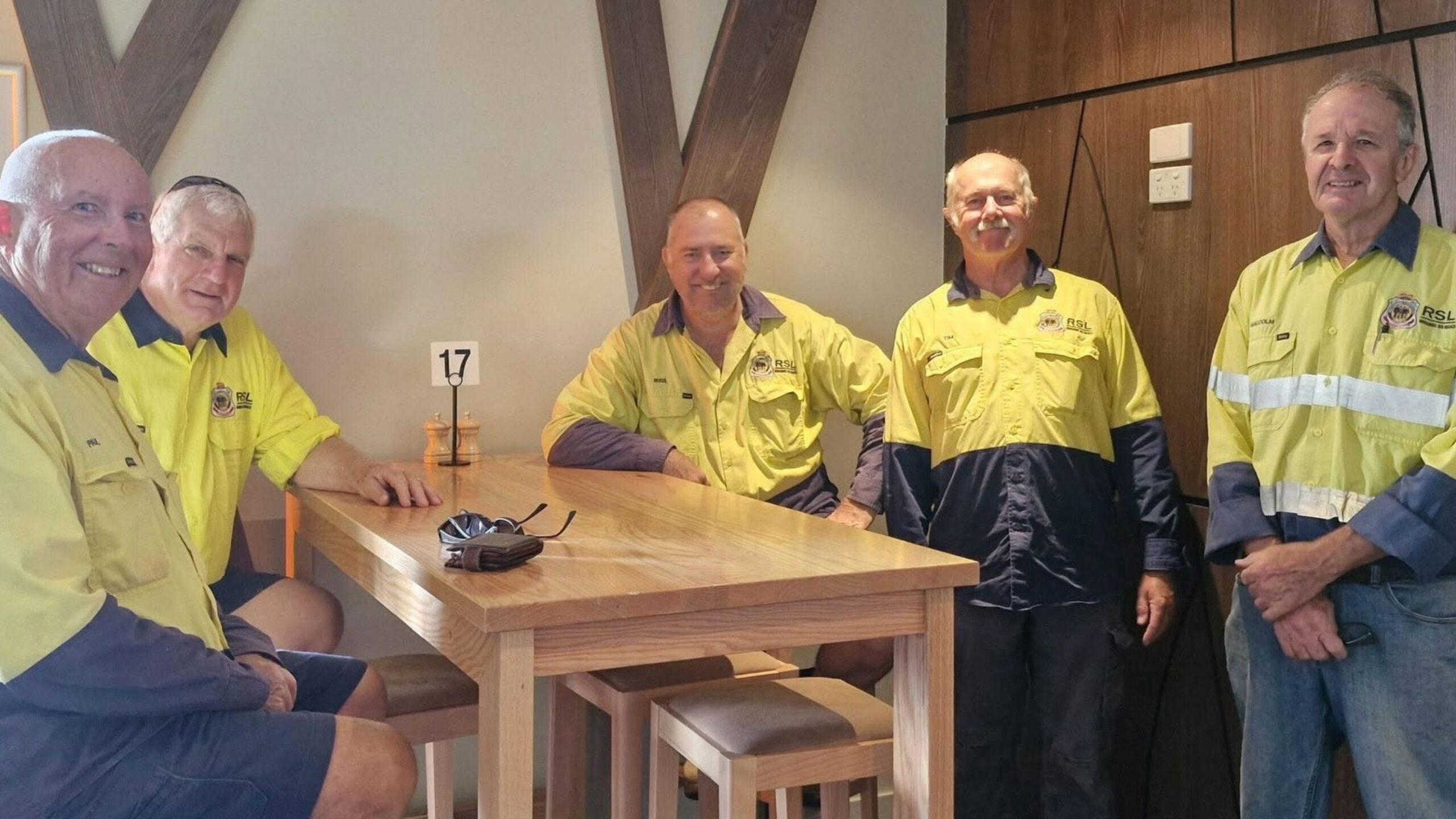 Bundaberg RSL mowing crew volunteers preparing lawn equipment to support local Veterans