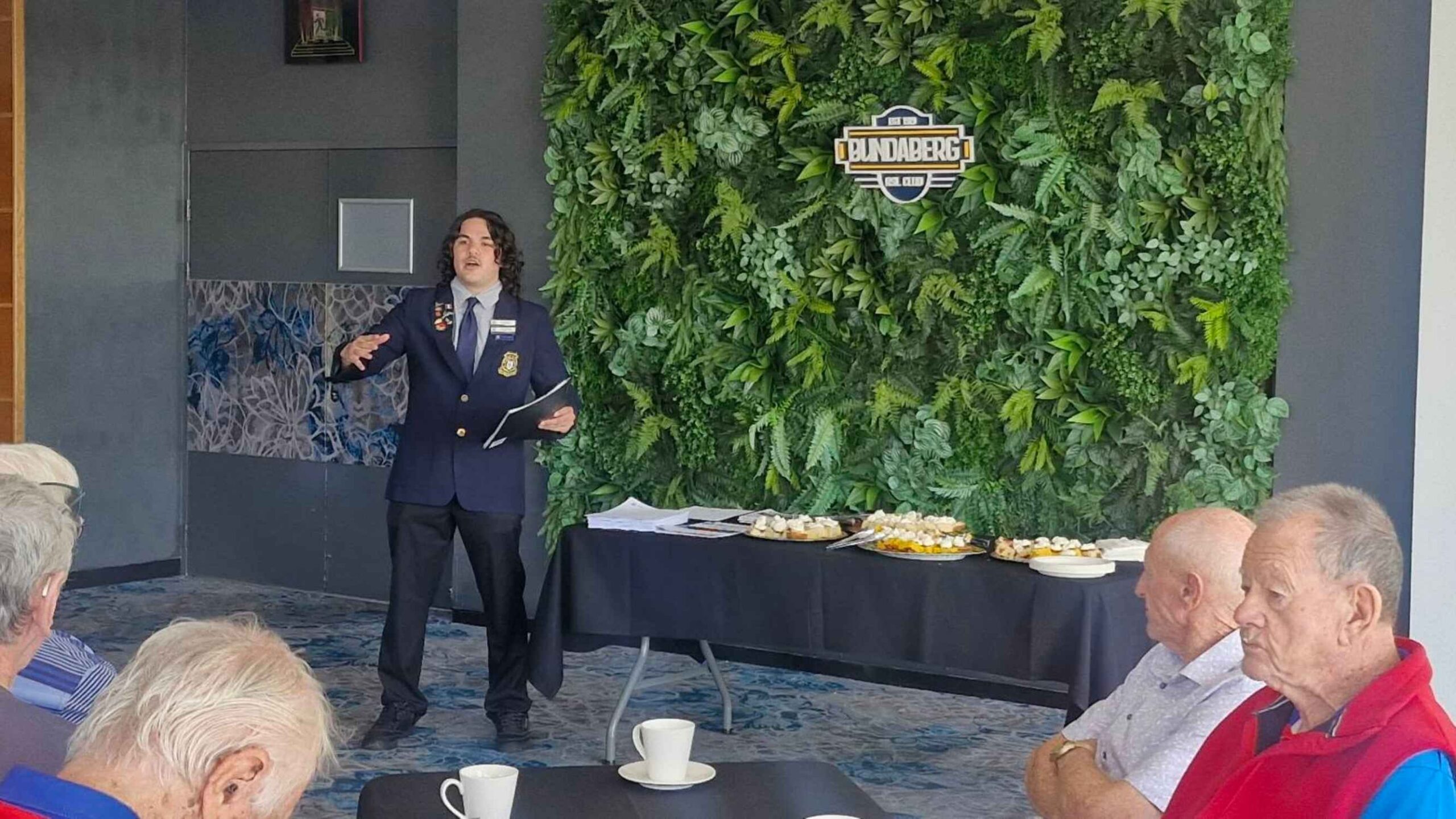 Seth Johnson from Bundaberg State High School speaking with veterans at Bundaberg RSL Club’s Veterans Morning Tea